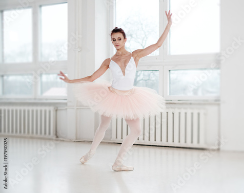 Gracefull ballerina in a dance studio.