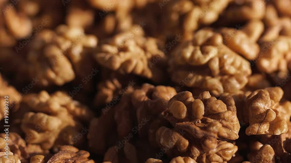 Walnut close up. product rich in minerals and vitamins. Walnut turns in a shot. walnut close up lies under beams of the sun. Walnut close up. Macro Walnut close up. product rich in minerals and vitamins. Walnut turns in a shot. walnut close up lies under beams of the sun. Walnut close up. Macro
