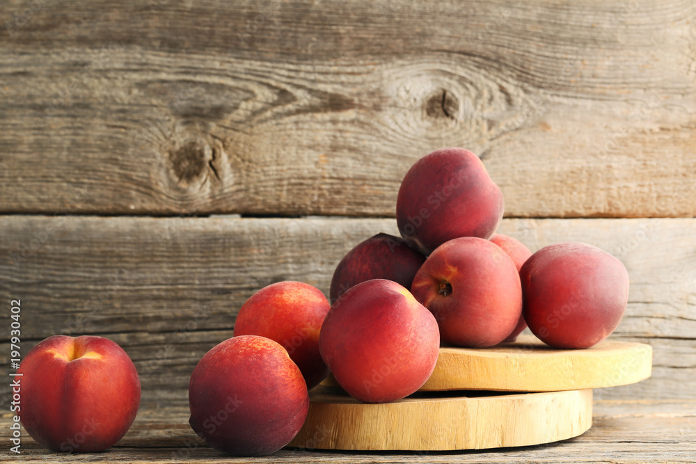 Sweet nectarines on wooden cutting board Sweet nectarines on wooden cutting board