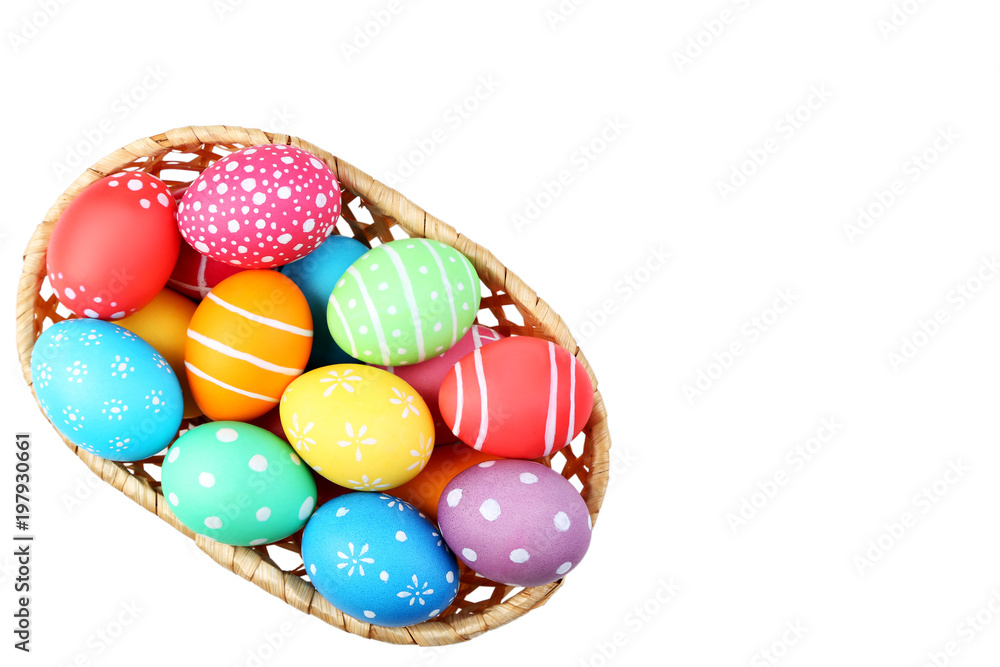 Fototapeta premium Colorful easter eggs in basket isolated on white background
