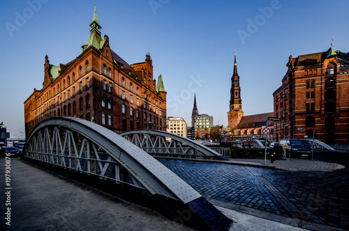 Hamburg storage city in the morning with St. Catherine's Church and St. Nicola after rain showers © mstein