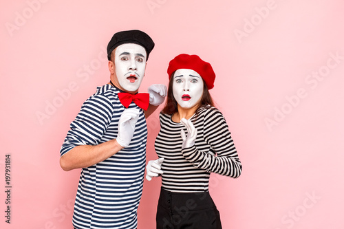 Фотография Portrait of very scared young adult couple