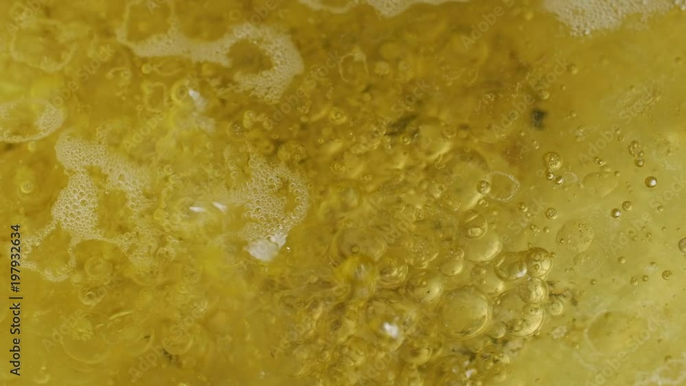 Abstract close-up on the surface of boiling water and oil . Abstract close-up on the surface of boiling water and oil .