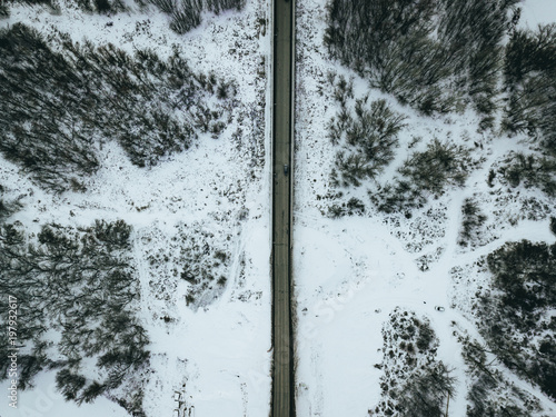 aerial top down view of the highway on a winter snowy day