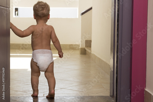 Back View Of Toddler Wearing Nappy. Indoor photo. Concept. Copy space photo