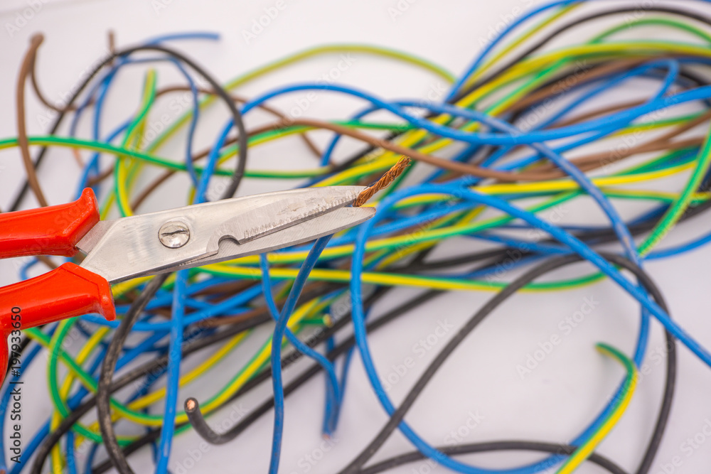 electrician cuts electric wires. Electric cables electrician cuts electric wires. Electric cables
