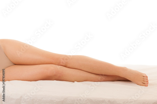 Beautiful long slim and elegant woman legs isolated over white background