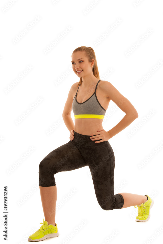 beautiful young fit woman makes lunge step isolated over white background beautiful young fit woman makes lunge step isolated over white background