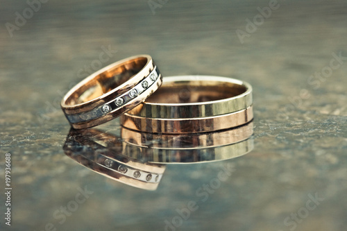 Two gold wedding rings of white and yellow gold photo