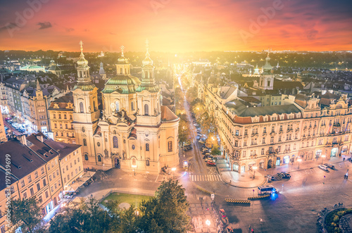 Panoramic view to St. Nicholas Church at old town square with beautiful sunset in the Prague