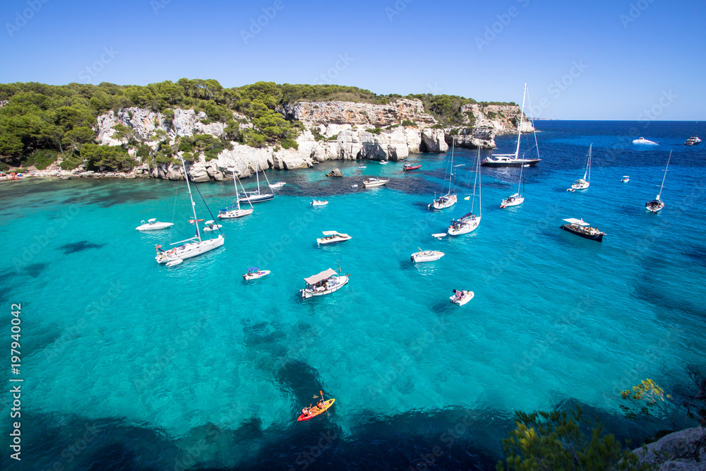 Obraz premium Boats and yachts on Macarella beach, Menorca, Spain