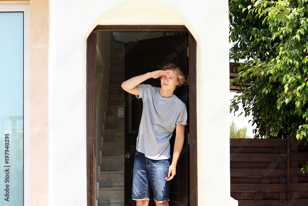 Man opening the door of her home.Inviting the guests Man opening the door of her home.Inviting the guests
