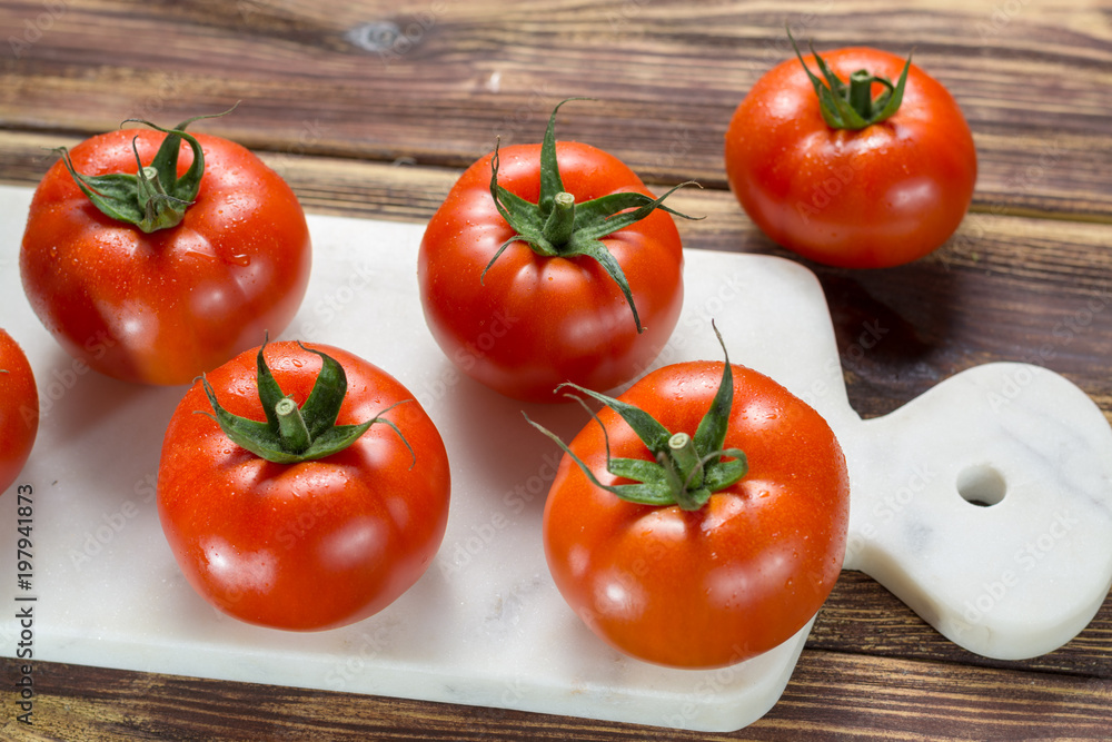 Tasty red ripe tomatoes gourmato from Belgium close up, ingredients for healthy salad close up Tasty red ripe tomatoes gourmato from Belgium close up, ingredients for healthy salad close up