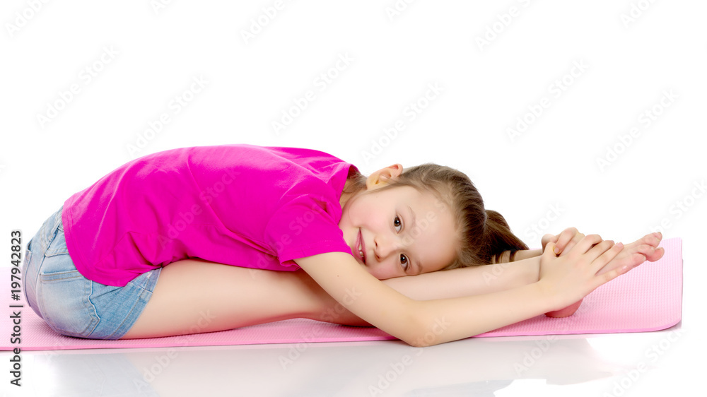 The gymnast perform an acrobatic element on the floor. The gymnast perform an acrobatic element on the floor.