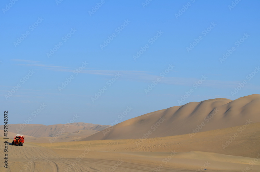Buggy at sand dunes in Huacachina desert, Ica, Peru Buggy at sand dunes in Huacachina desert, Ica, Peru