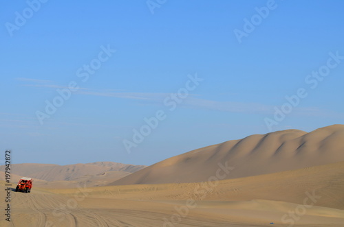 Buggy at sand dunes in Huacachina desert, Ica, Peru