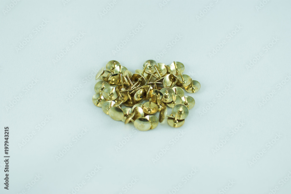 Golden thumbstacks on white background. Isolated Golden thumbstacks on white background. Isolated