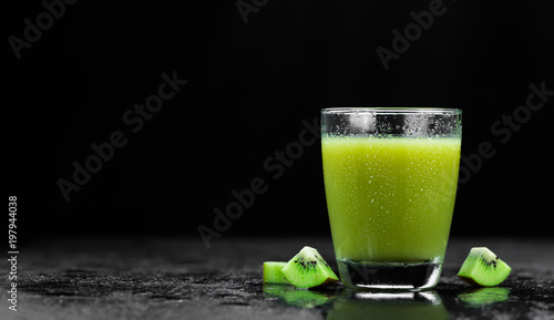 Kiwi Smoothies on a slate slab (selective focus)