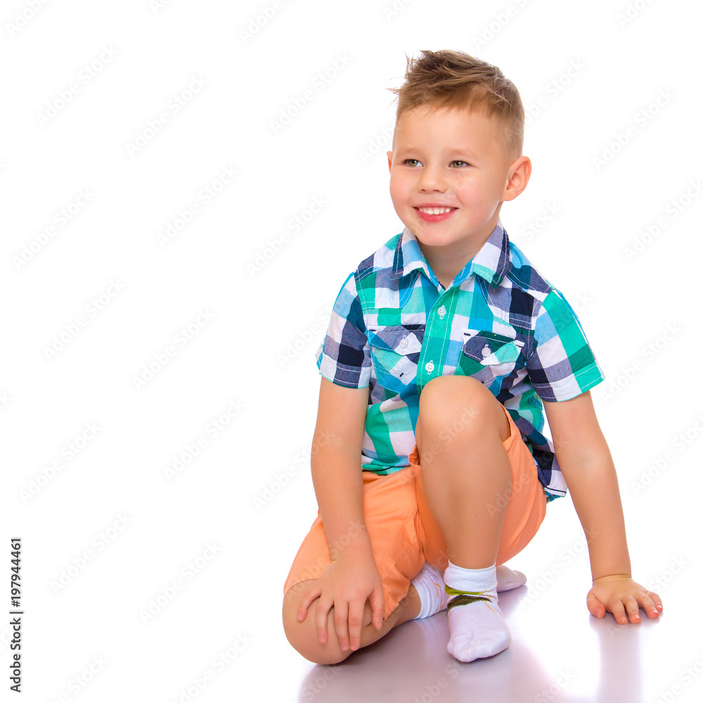 little boy is sitting on the floor little boy is sitting on the floor