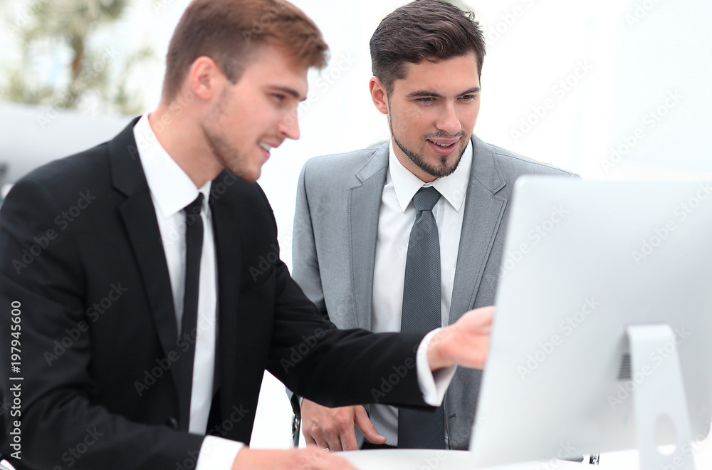 employees are talking sitting behind a Desk employees are talking sitting behind a Desk