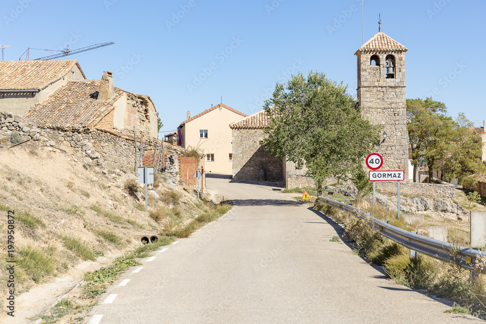 paved road passing through Gormaz village, province of Soria, Spain