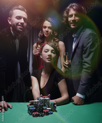 Woman doing all-in playing poker photo