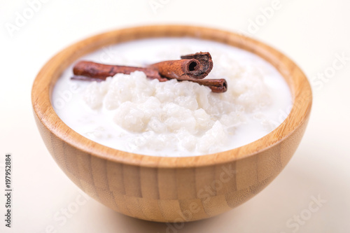 Brazilian winter festival dessert Canjica. White corn porridge photo