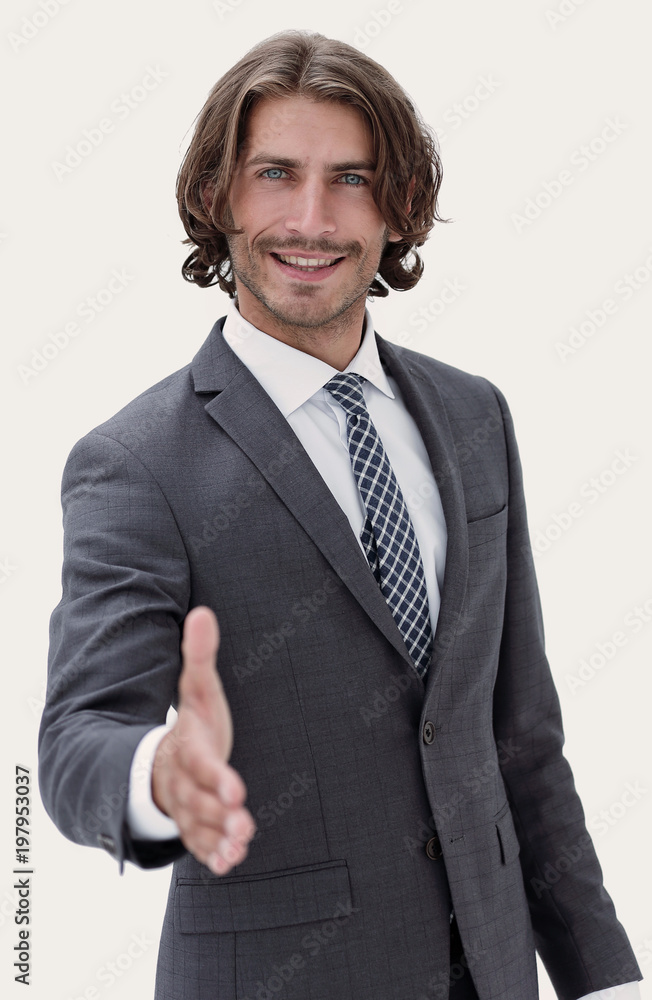 Smiling friendly businessman offers a handshake Smiling friendly businessman offers a handshake
