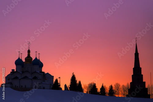 Kazan city Kremlin at pink purple sunset. Suyumbike Tower and Annunciation Cathedral. Russia, Republic of Tatarstan photo