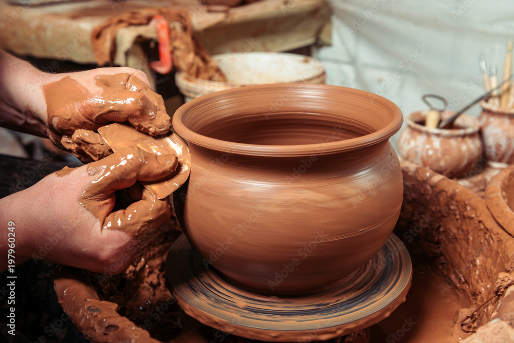 Potter at work. Workshop place. Potter at work. Workshop place.