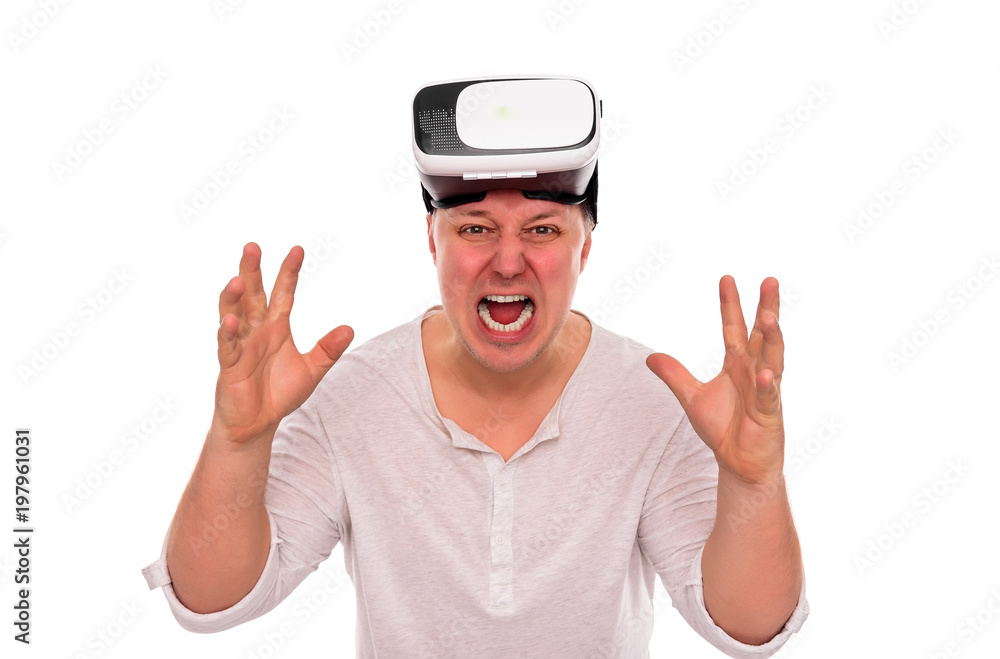 Naklejka premium Angry man with glasses or a helmet of virtual reality on his head on a white.