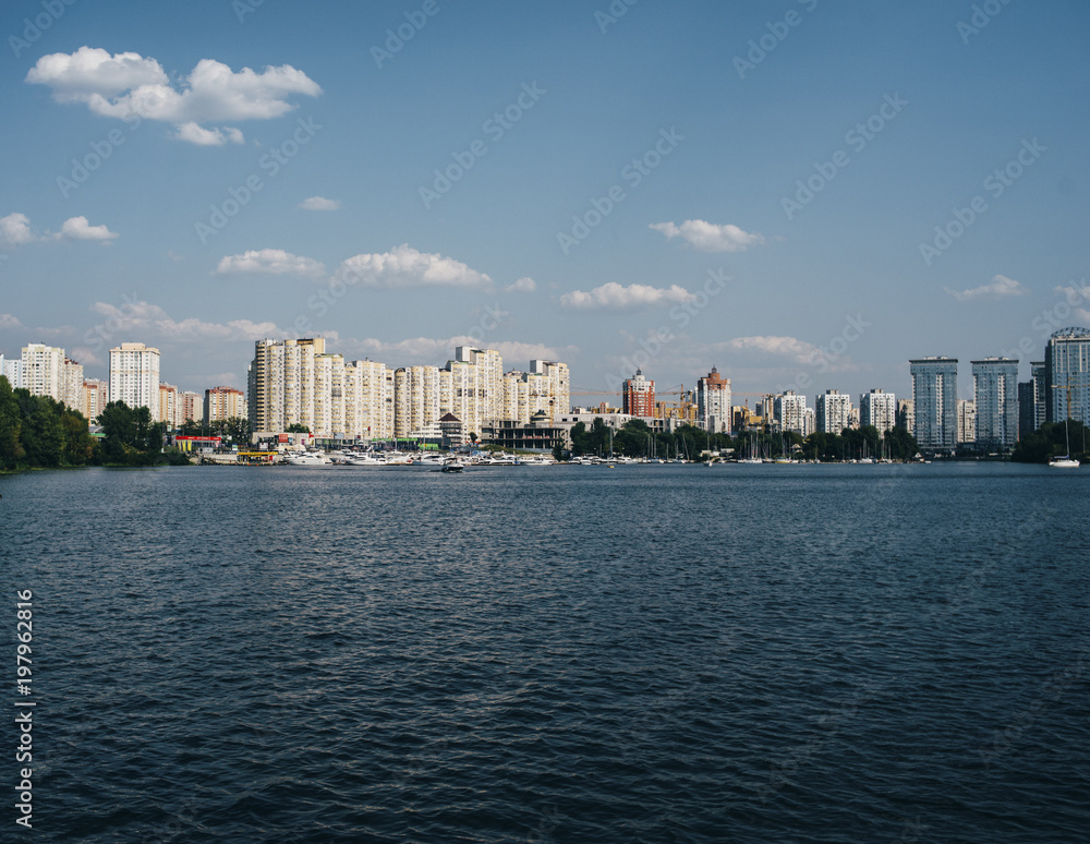 beautiful landscape with buildings and blue river and blue sky beautiful landscape with buildings and blue river and blue sky