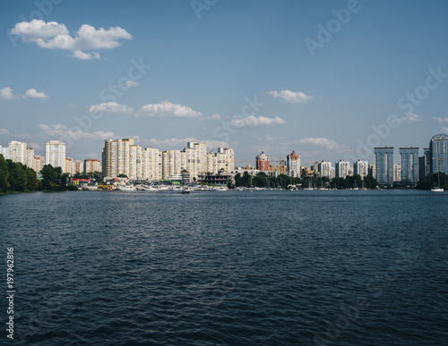 beautiful landscape with buildings and blue river and blue sky