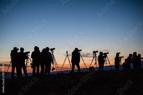 A group of photographers waitting for sunrise in outside