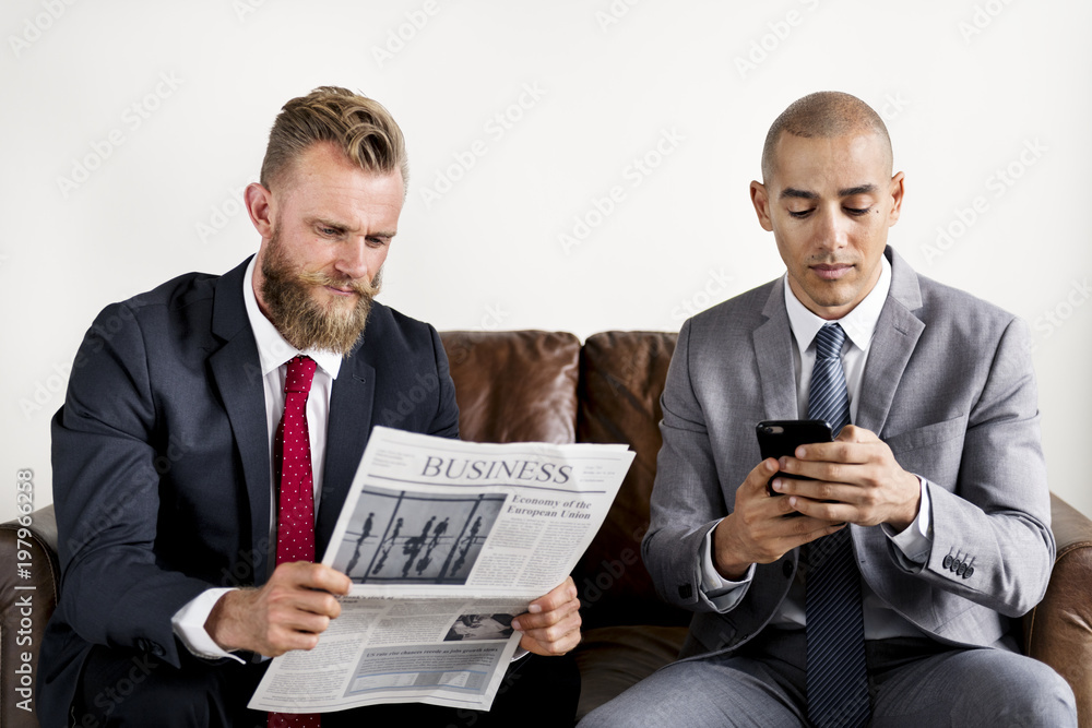 Two businessman sitting on a couch Two businessman sitting on a couch