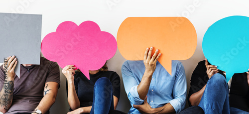 Group of diverse people with speech bubbles icons photo