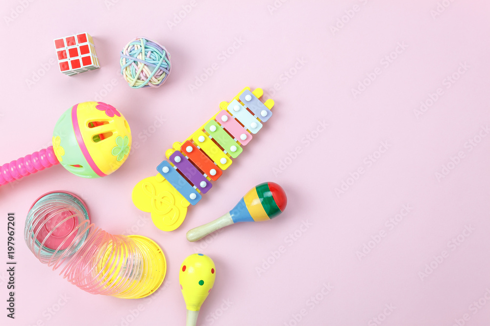Table top view aerial photo of kids toys collection background concept.Flat lay objects for development children on modern pink paper on office desk.Free space for creative design add text & word. Table top view aerial photo of kids toys collection background concept.Flat lay objects for development children on modern pink paper on office desk.Free space for creative design add text & word.