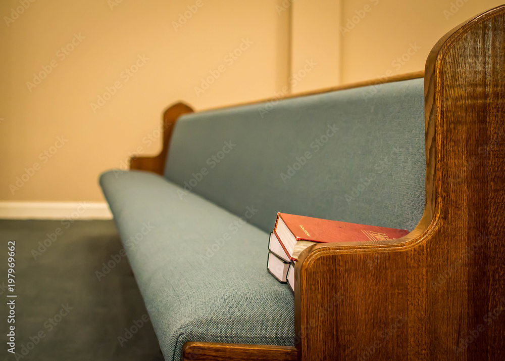 Fotografie Empty pews with stacked books