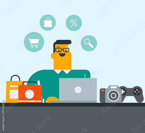 Young caucasian white man sitting at the table and using computer for online shopping