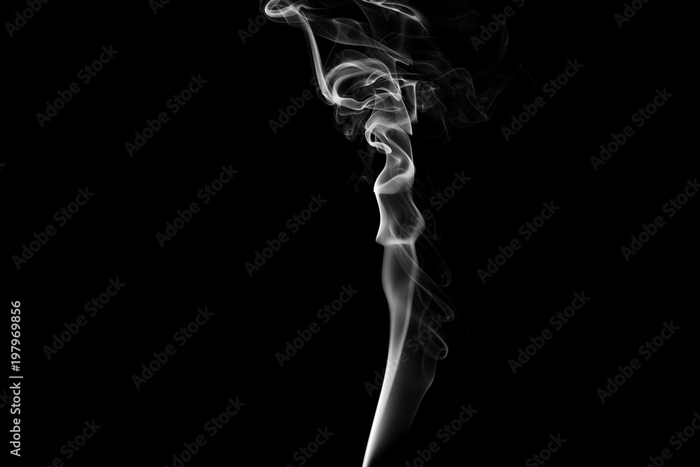 Smoke the white incense on a black background. darkness concept Smoke the white incense on a black background. darkness concept