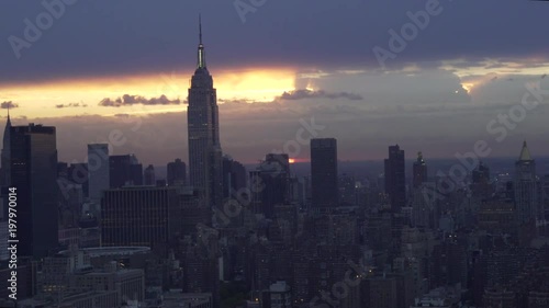 New York City telephoto aerial view of the Empire State Building and Midtown Manhattan skyscrapers at sunrise. photo