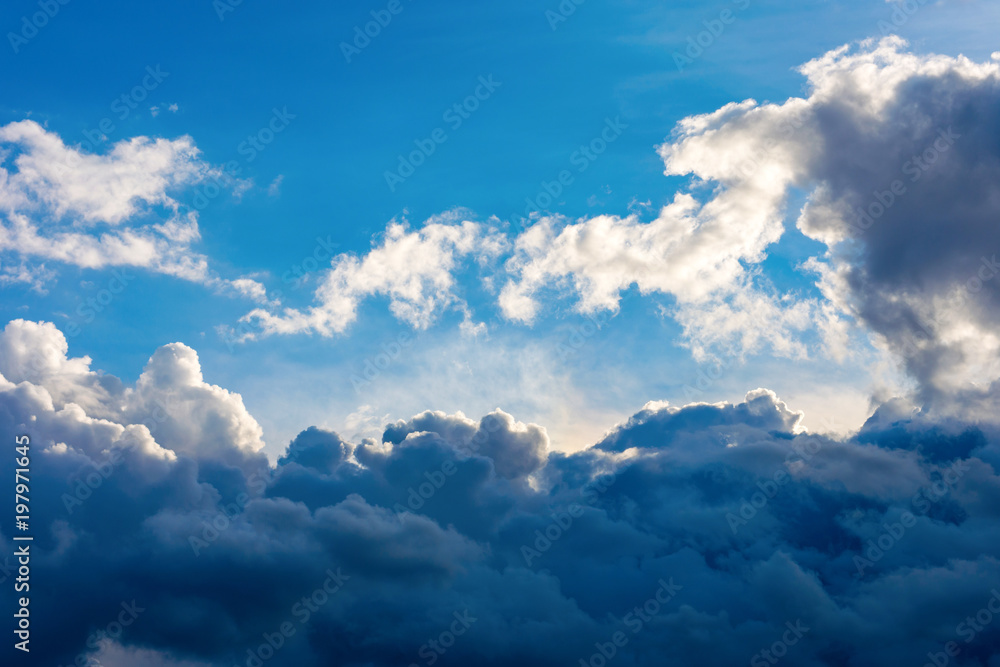 Photo of a blue sky with dark clouds Photo of a blue sky with dark clouds