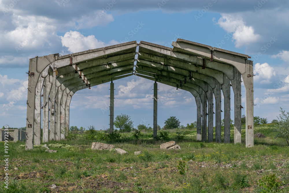 A former soviet building in ruins in an abandoned field