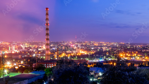 View to the city of Chisinau and it's lighting at sunset in Chisinau, Moldova © Ungureanu