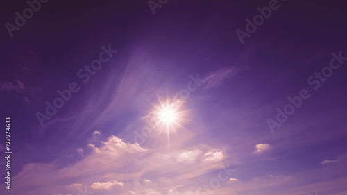 bright evening violet purple sky with sun and rays.