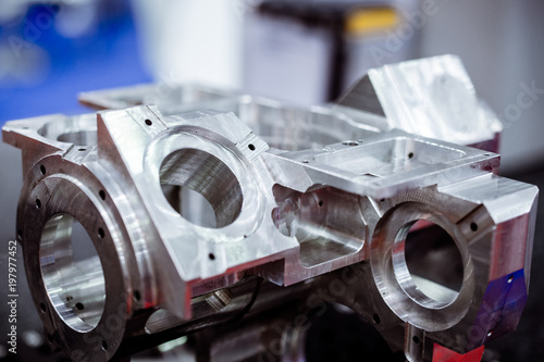 Detail of aluminum machined parts, shiny surface. photo