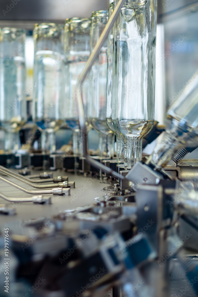 The working mechanism of the machine for washing glass bottles. Close-up photo.