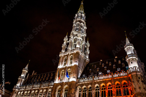 The belfry tower of Brussels is illuminated and lit up at night, Belgium
