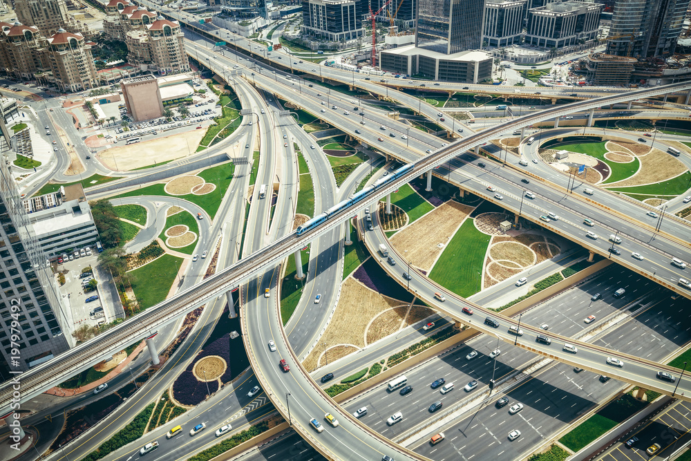Obraz premium Scenic aerial view of big highway intersection in Dubai, UAE, at daytime. Transportation and communications concept.
