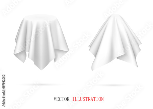 Objects covered with white cloth.
